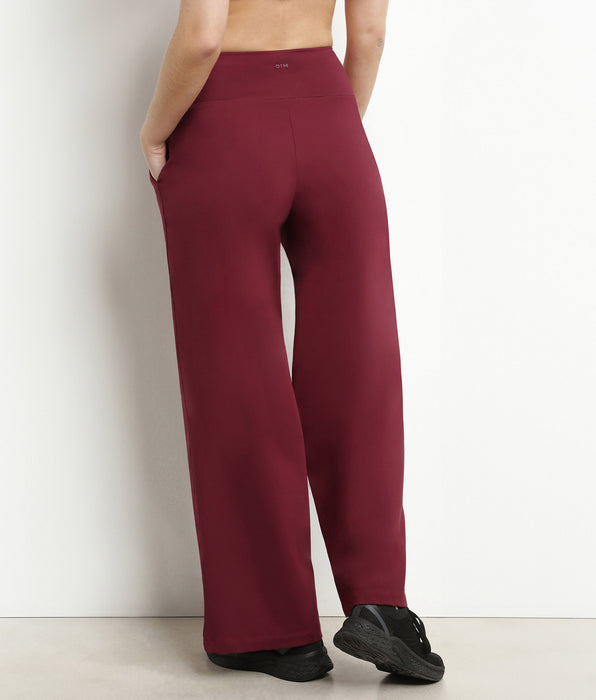 DIM Pantalon de sport femme large en jersey stretch Bordeaux Dim Move